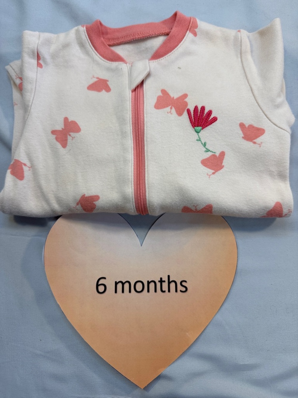Tuffy Baby Onesie with Pink Accents and embroidered flower on left chest